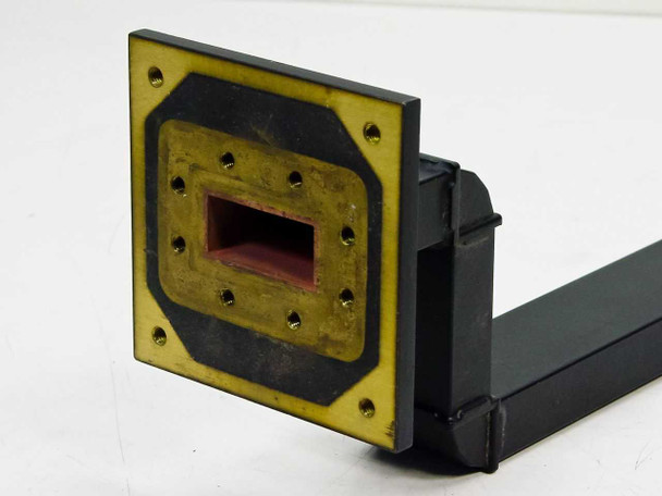WR-137 waveguide 01007714-01 — front-on view of large square rigid flange (85mm x 85mm) with brass face and rectangular waveguide aperture