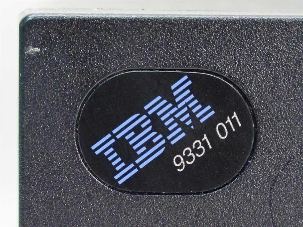 Close-up of IBM 9331 011 logo badge on front panel of the external floppy drive enclosure