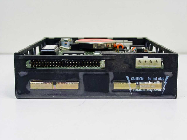 Omega Beta 44A optical drive – rear view showing 50-pin interface connector, power connector header, and caution label regarding connector orientation