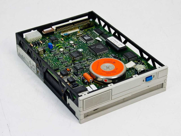 Omega Beta 44A 44MB 5.25-inch optical drive – angled top view showing open chassis and main PCB with controller chips and optical disk mechanism