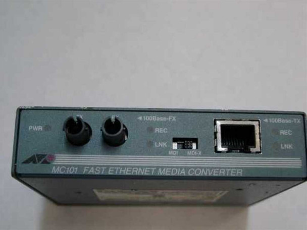 Allied Telesyn AT-MC101 front panel showing 100Base-FX ST fiber ports, PWR LED, 100Base-TX RJ-45 port, REC/LNK indicators, and MDI/MDIX switch