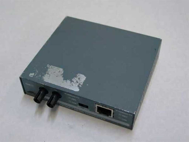 Allied Telesyn AT-MC101 Fast Ethernet Media Converter — front/top angled view showing ST fiber ports and RJ-45 port with paint wear on top