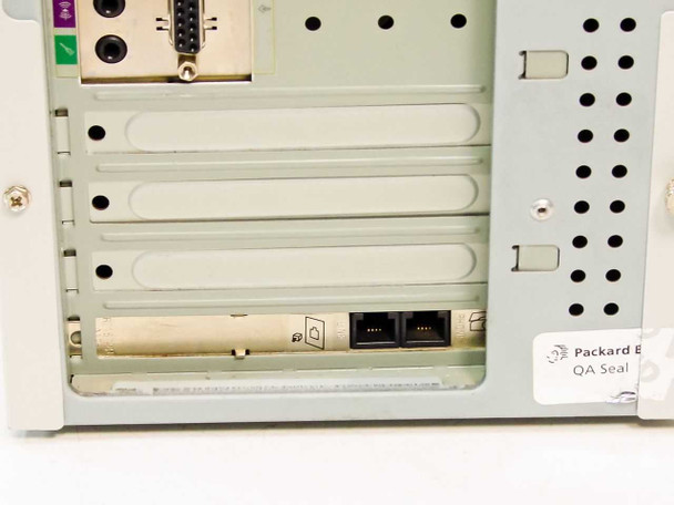 Packard Bell 820 interior rear detail showing expansion slot area with a low-profile card installed, Packard Bell QA seal visible on chassis