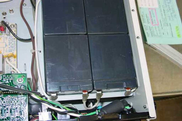 Liebert RT1000-60 UPS interior — alternate angle of defective battery pack and surrounding wiring and circuit boards