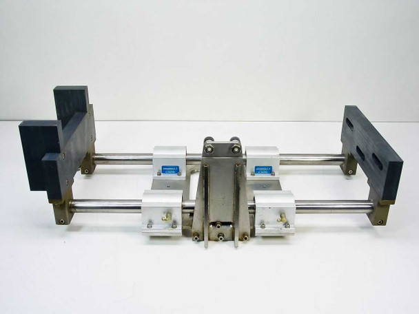 Thomson SSUPB16 linear guide — front end-on view clearly showing both parallel shafts, 4 white aluminum Super Smart pillow blocks with blue Thomson labels, and dark end support blocks