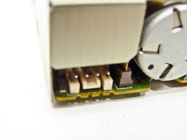 Toshiba ND-3567AR close-up of power connector and stepper motor on PCB edge