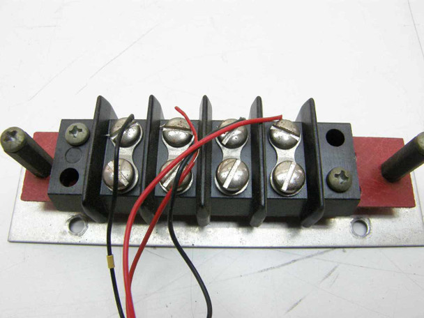 Thermco 4104 contact/wiring block close-up – front view showing screw terminals on black housing mounted on red PCB and aluminum bracket with probe stubs