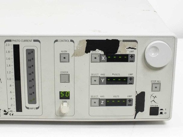 Newport ORION-CM right-side angle view showing photo current meter, control panel, axis display section with X/Y/Z bars, STOP ALL button, and power switch
