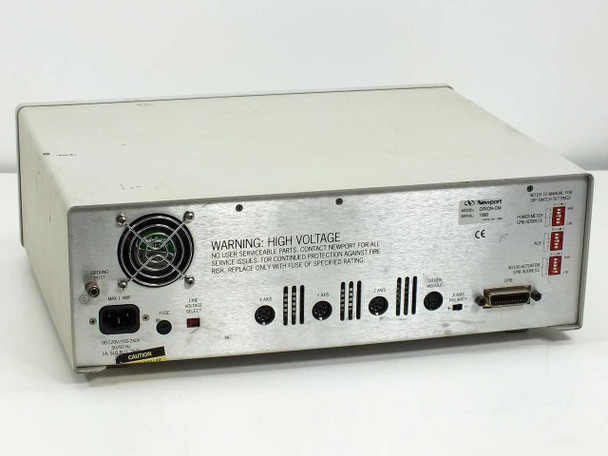 Newport ORION-CM rear panel full view showing IEC AC inlet, cooling fan, warning label, axis DIN connectors, GPIB connector, and Newport label with ORION-CM model