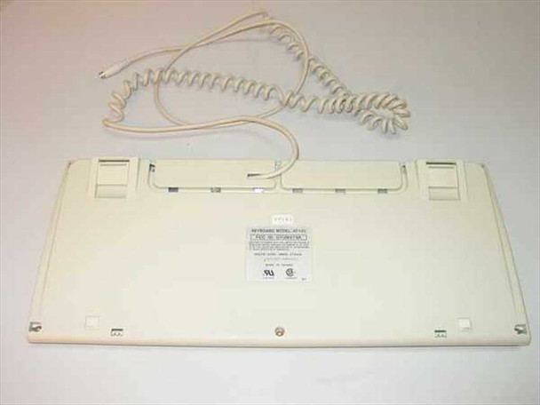 Dell AT101 GYUM97SK keyboard – bottom view showing full underside, label, and coiled PS/2 cable