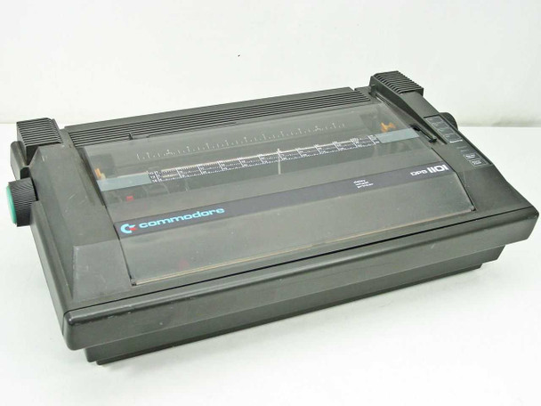 Commodore DPS-1101 Daisy Wheel Printer – front three-quarter view showing dark plastic housing and paper guide under clear cover