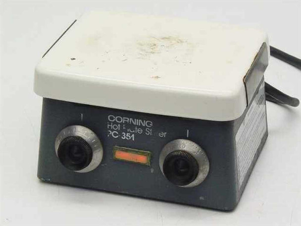 Corning PC-351 Hot Plate Magnetic Stirrer front view showing dual control knobs, orange indicator light, and white ceramic top plate with surface soiling