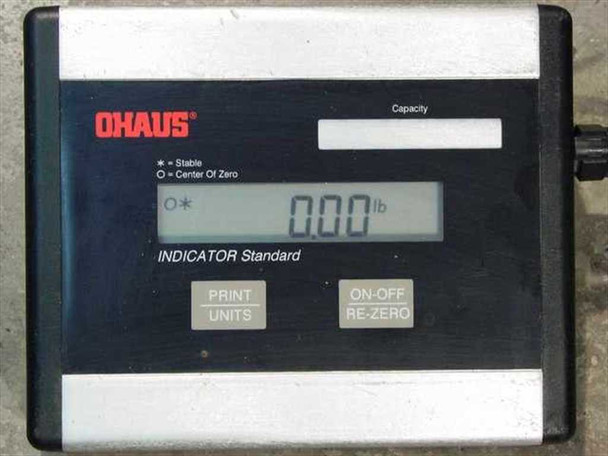 Ohaus I5S digital indicator close-up showing LCD display reading 0.00 lb, Print/Units and On-Off/Re-Zero buttons, and Ohaus branding