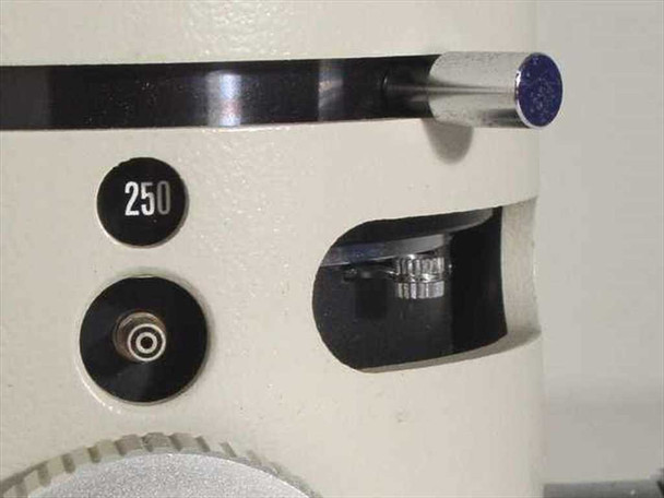 Nikon PFX shutter detail showing 1/250 speed marking on dial, flash sync port, and shutter cocking mechanism with knurled knob