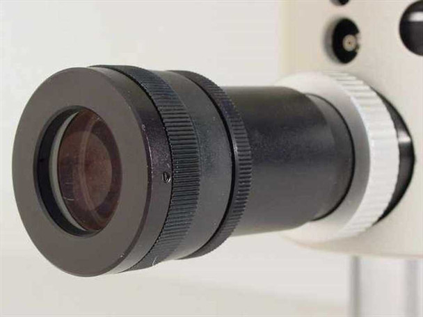 Nikon PFX eyepiece and viewfinder close-up showing black barrel with focusing ring and clear glass element