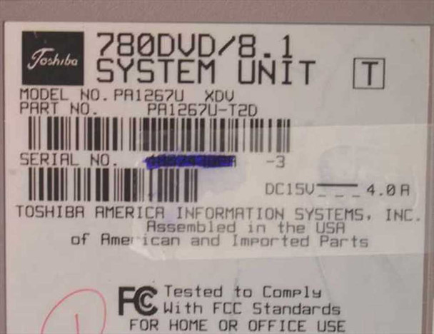 Toshiba Tecra 780DVD bottom label showing model PA1267U XDV, part number PA1267U-T2D, DC 15V 4.0A rating, and FCC compliance markings