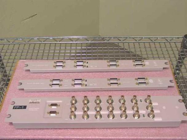 Nortel Passport 6480 front panels laid out on pink foam — balanced panels and sparing panel with DB connectors and BNC ports