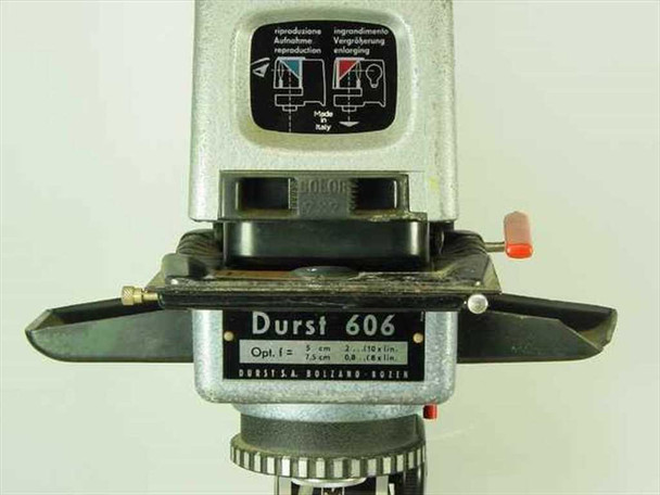 Durst 606 enlarger head close-up showing model nameplate, negative stage with red knob, and multilingual instruction label; Durst S.A. Bolzano/Bozen marking visible