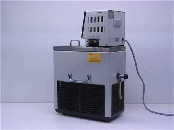 Brinkmann MGW Lauda RM6 water bath chiller — rear view showing control head vents, bath tank rear, refrigeration louvres, external circulation ports with fittings, and power cord