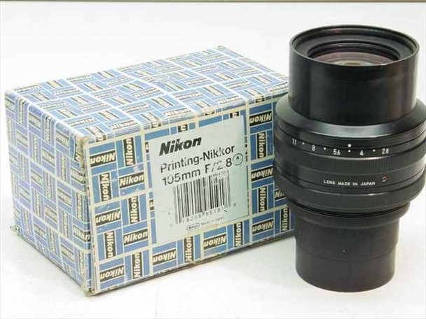 Nikon Printing-Nikkor 105mm f/2.8 enlarging lens shown next to its original blue Nikon box