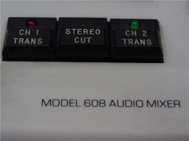 Graham Patton Systems 608 close-up of CH 1 Trans, Stereo Cut, and CH 2 Trans buttons with red and green LEDs, and MODEL 608 AUDIO MIXER label