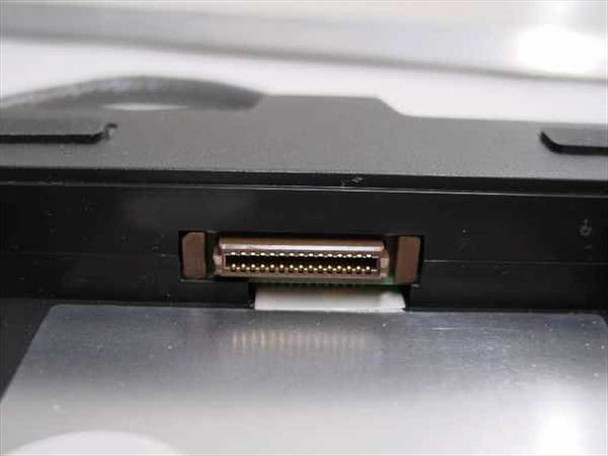 Compaq 258575-002 floppy drive caddy side view showing internal proprietary connector slot