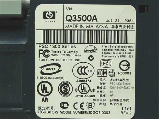 HP PSC 1350 bottom label showing model Q3500A, PSC 1300 Series, manufactured July 21 2004, Made in Malaysia, REV 2