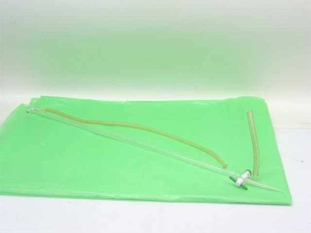 Lab Crest FxP glass manual titrator laid flat showing full length of glass body and yellow rubber tubing on green background