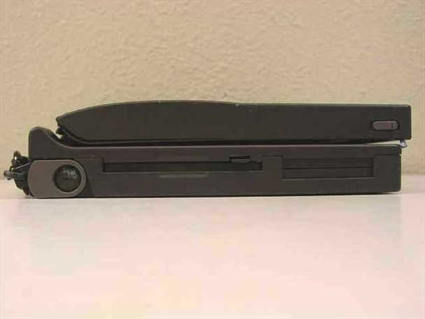 Compaq Contura 430C 2860C laptop left side view showing 3.5-inch floppy disk drive bay and closed lid profile