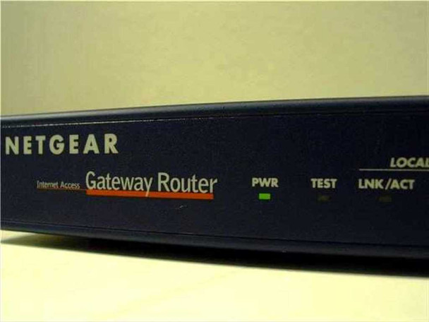 Netgear RT311 Gateway Router — angled front-left view showing PWR, TEST, and LNK/ACT LED indicators