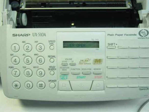 Sharp UX-510A — front panel close-up showing LCD displaying 'COVER OPEN', keypad, function buttons, and Plain Paper Facsimile label
