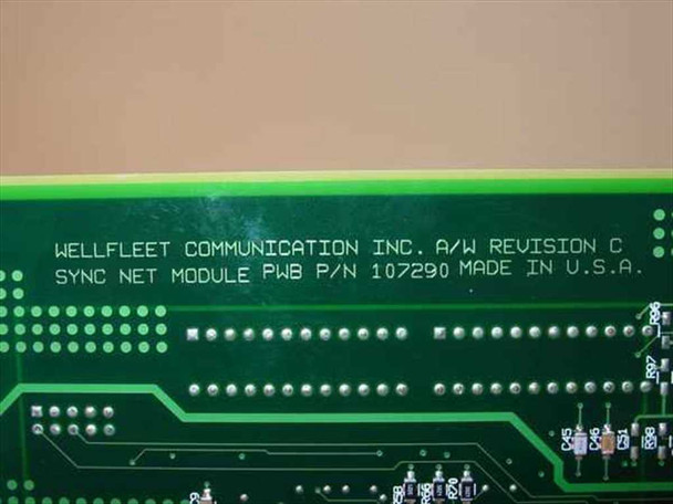 Wellfleet Communication Inc. PCB silkscreen label showing SYNC NET MODULE PWB P/N 107290, A/W Revision C, Made in U.S.A.