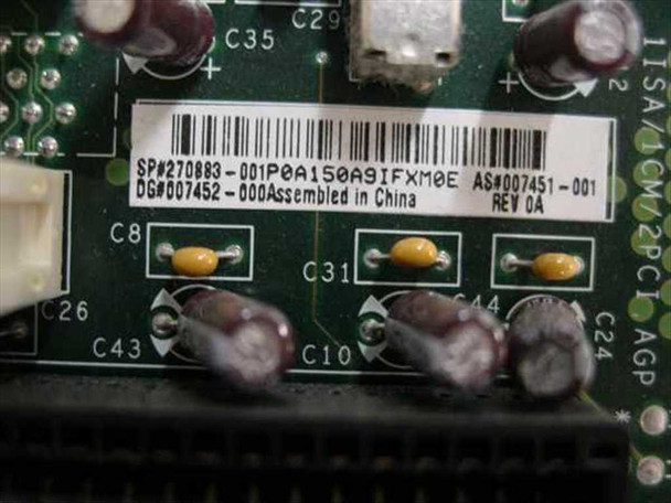 Compaq 270883-001 riser board label closeup showing part number SP#270883-001, AS#007451-001, DG#007452-000, Rev 0A, Assembled in China