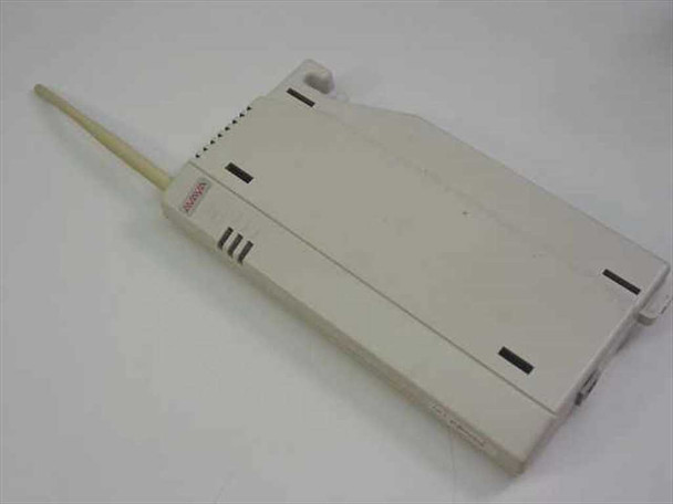 Lucent TransTalk 556E1 radio transmitter module — white plastic housing with external antenna, ventilation slots, and mounting clips