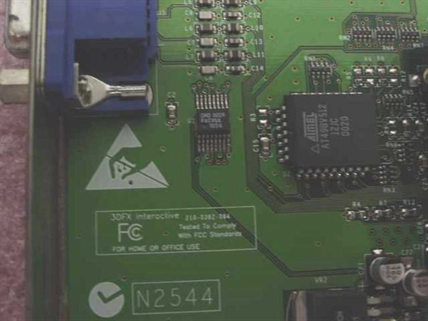 3dfx Voodoo3 2000 PCB close-up showing 3DFX Interactive 210-0382-004 label, FCC compliance marking, ATMEL IC, and N2544 asset tag