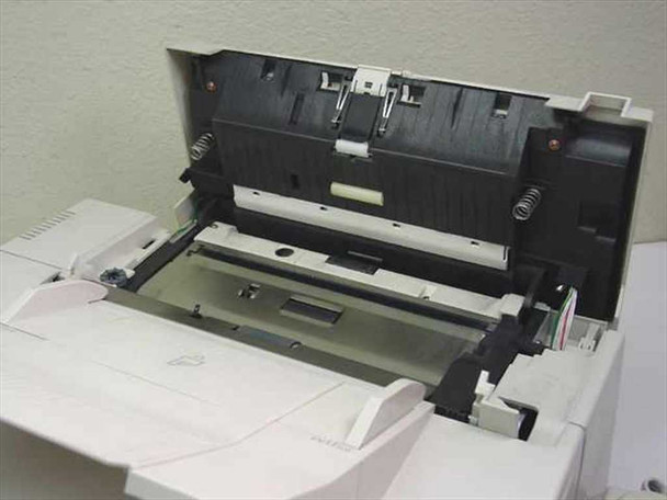 HP C2136A FAX-310 interior view with top cover open showing flatbed scanner glass, ADF paper path, and internal document transport mechanism