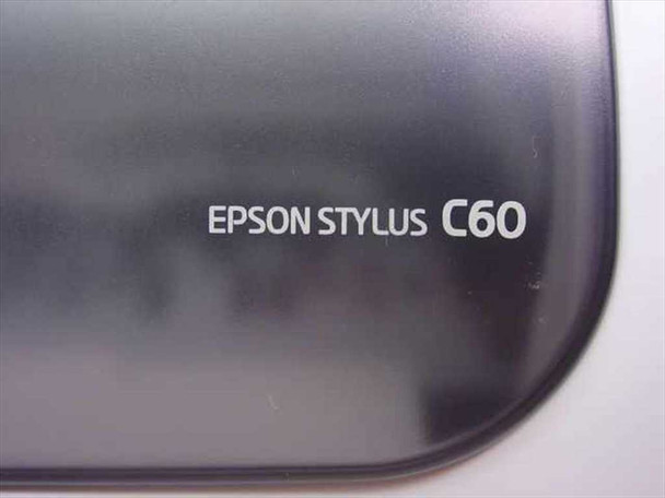 Close-up of Epson Stylus C60 model name badge on dark top cover