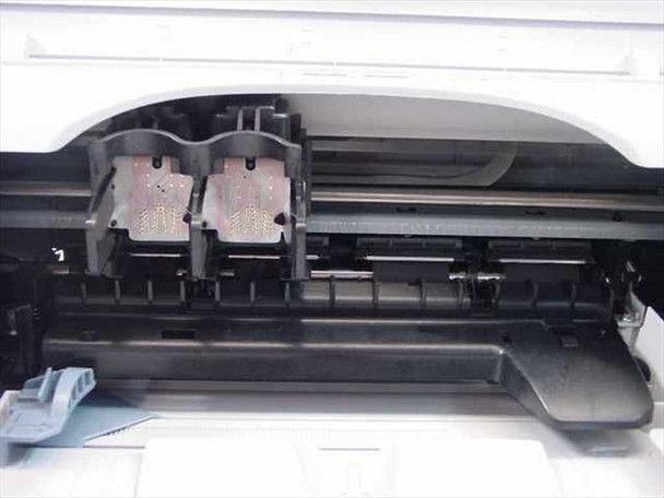 HP Deskjet 3425 interior view with lid open showing dual ink cartridge carriage and print mechanism