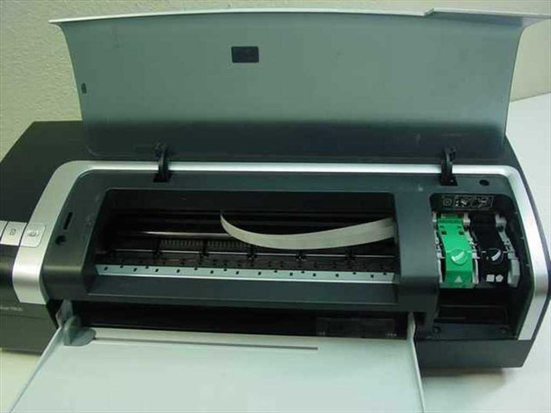 HP DeskJet 9800 top cover open showing print carriage assembly, ribbon cable, and ink cartridge cradle with green cartridge holder