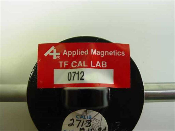 Rear stem of Mitutoyo 2805-10 dial indicator showing Applied Magnetics TF Cal Lab calibration sticker and calibration label
