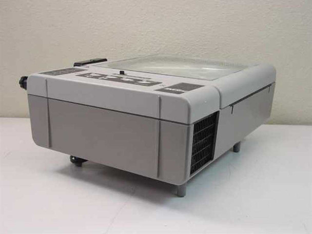 Dukane 653 28A653A overhead projector right-side view showing ventilation grille and rubber feet with arm folded