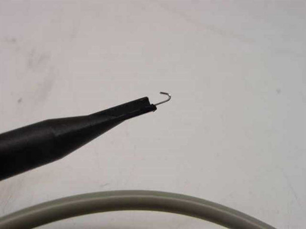 HP 10432A probe tip close-up — fine hook tip attached to black probe barrel