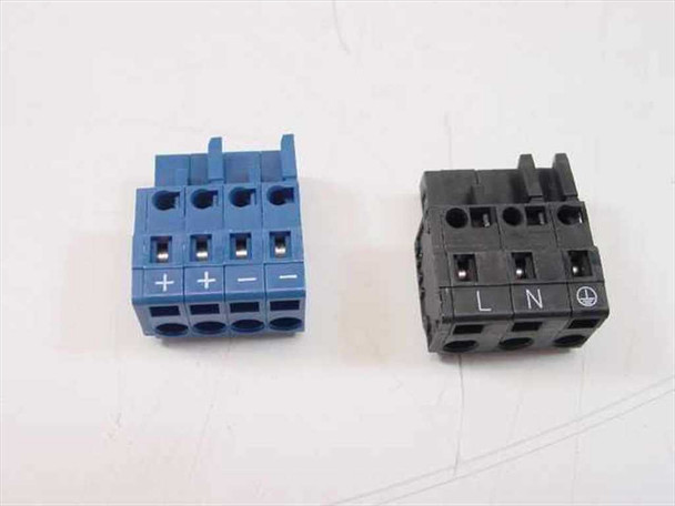 Both WAGO pluggable connector blocks removed — blue 4-terminal output block (+/+/−/−) on left and black 3-terminal input block (L/N/GND) on right