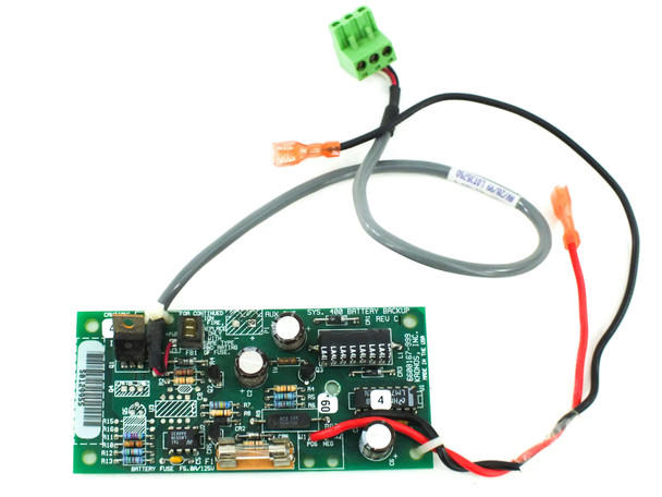 Kronos 6600167-999 Rev C Sys 400 Battery Backup board — top side showing components, fuse, green terminal block, and wiring harness