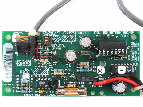 Kronos battery backup board close-up showing AUX OUT label, SYS 400 BATTERY BACKUP silkscreen, Rev C marking, and F5.0A/125V fuse