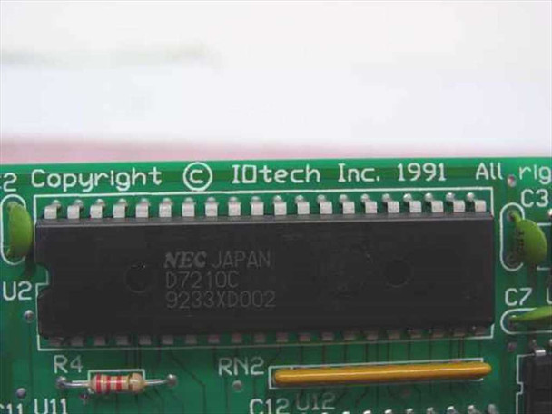 IOtech 1700-0113 close-up of NEC D7210C GPIB controller chip with IOtech Inc. 1991 copyright marking on PCB