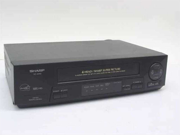 Sharp VC-A410U 4-Head VHS VCR — front three-quarter view showing cassette door and control panel