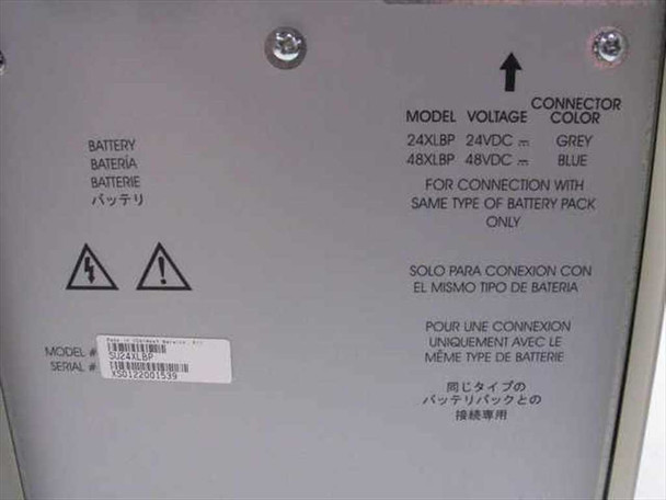 APC SU24XLBP bottom label showing model SU24XLBP, 24VDC voltage, grey connector designation, and serial number