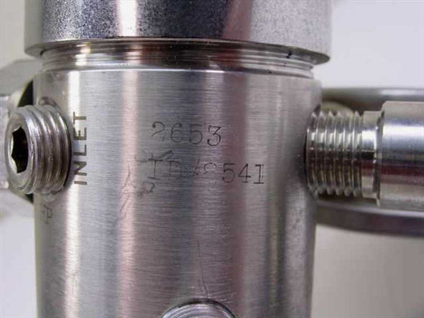 Pacific Scientific 2653 regulator body close-up showing stamped model number 2653 and INLET port marking