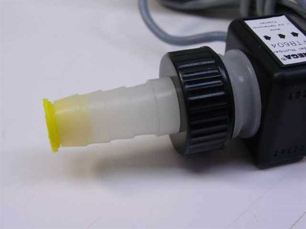 Omega FTB604 flow meter close-up of barbed inlet fitting with yellow protective end cap and sensor body label